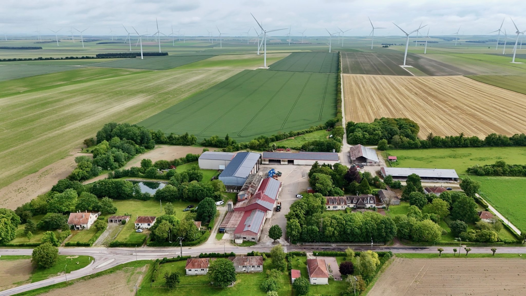 Aerial view of the Bonne Voisine agricultural platform and surrounding wind farms